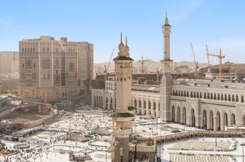 a view of a city with a clock tower at Anjum Makkah Hotel in Makkah