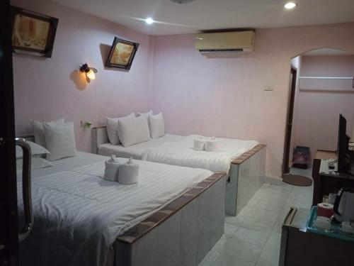 Postel nebo postele na pokoji v ubytování Marina Resort