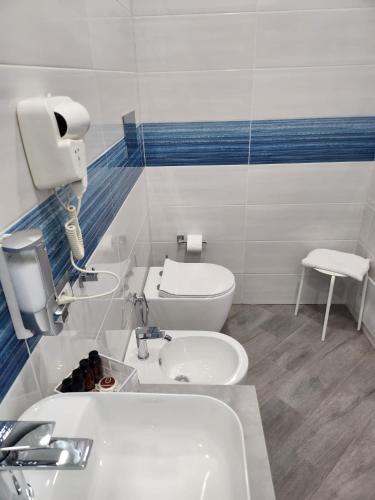 a bathroom with a sink and a toilet at Gradini Partenopei in Naples