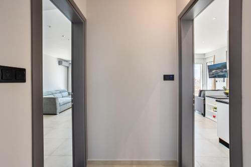 a sliding glass door leading into a living room at Yin & Yang Studio, Marina Hideout in Kalamata (B3) in Kalamata