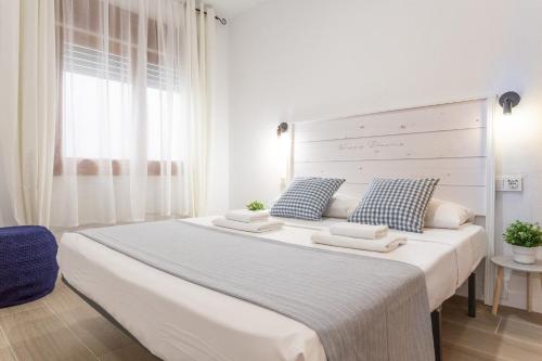 En eller flere senge i et værelse på Apartamento Piolín
