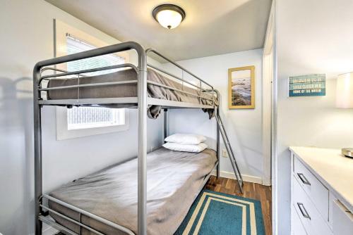 a bunk bed in a small room with a counter at The Starfish Hampton Cottage Walk to Beach! in Hampton