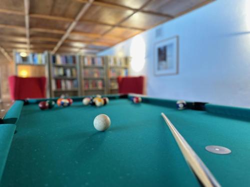 a pool table with a ball on top of it at Appartementhaus Birkenwald in Seefeld in Tirol