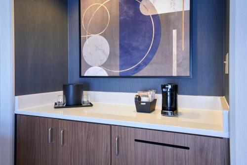 a coffee maker sitting on a counter in a room at Courtyard Chicago Lincolnshire in Lincolnshire