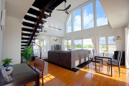 a living room with a couch and a table at Beach Bliss in Navarre