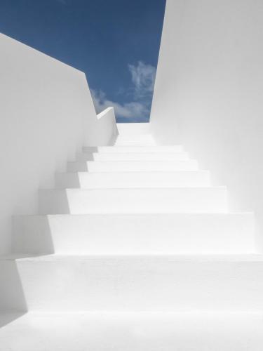 an image of a white stairway in the sky at KA BRU 1100 Boutique Hotel in Taipu