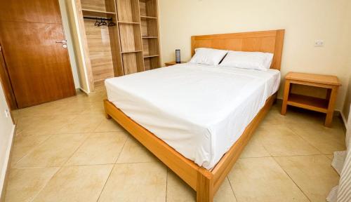 Una cama o camas en una habitación de Ferme d'hôte Evasio