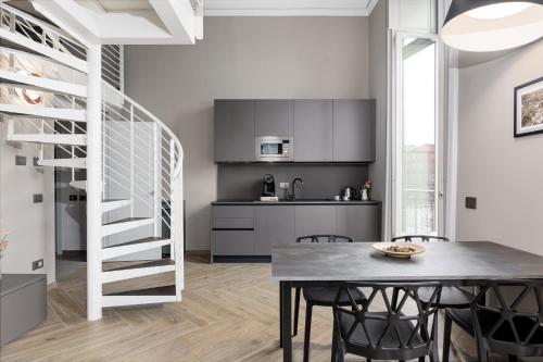 Kuchyň nebo kuchyňský kout v ubytování Q71 TIMELESS SUITES