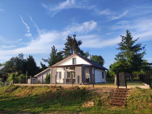 an old house on top of a hill at Tonkielek - Domek z Jacuzzi Nad Rzeką Bug in Tonkiele