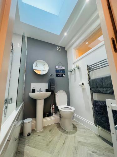 a bathroom with a toilet and a sink at The Annex in Southend-on-Sea