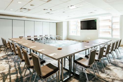 a large conference room with a large table and chairs at Hilton Garden Inn Denver Union Station in Denver