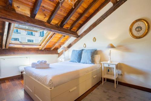 a bedroom with a large bed in a room with wooden ceilings at Calm and bright apartment, center La Latina D.ALB in Madrid