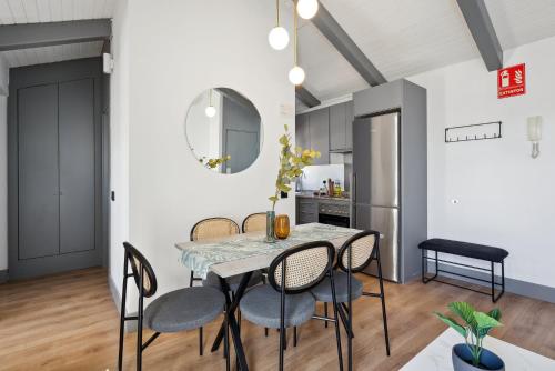 a dining room with a table and chairs at limehome Madrid Calle de Santa Ana in Madrid