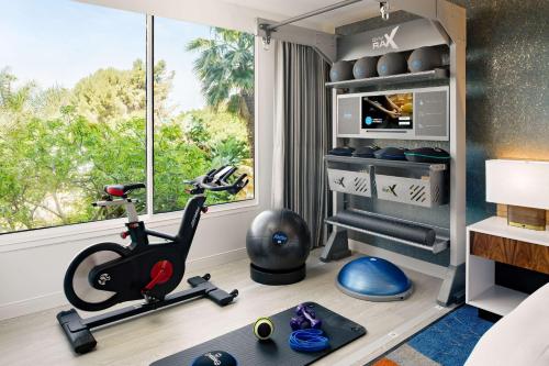 a room with a gym equipment and a window at Hilton Los Angeles-Culver City, CA in Los Angeles
