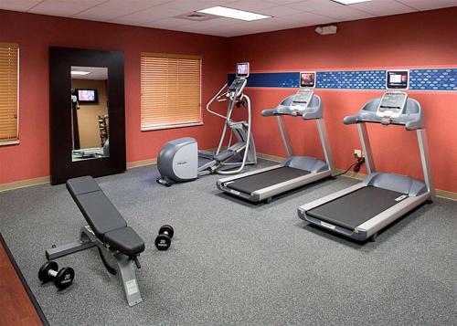 a gym with several tread machines in a room at Hampton Inn & Suites Clovis Airport North in Clovis