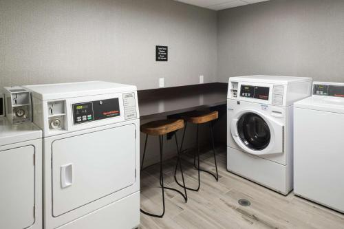 a laundry room with a washer and dryer at Hampton Inn Los Angeles Santa Clarita in Santa Clarita