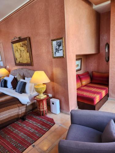 a living room with a bed and a couch at La Maison de Tanger in Tangier
