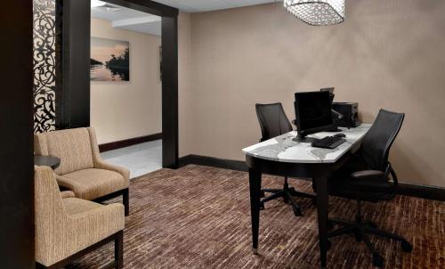 an office with a desk with a computer on it at Homewood Suites Lafayette-Airport in Lafayette