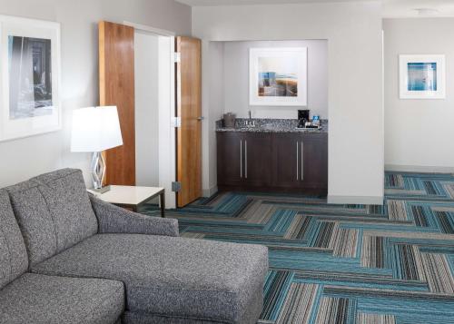 a living room with a couch and a table at Hampton Inn San Diego Downtown in San Diego