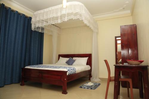 Cama o camas de una habitación en Jatheo Hotel Rwentondo