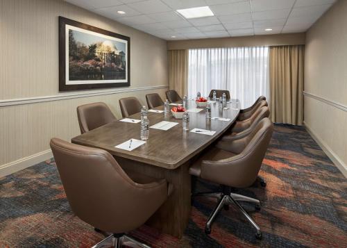 a conference room with a long table and chairs at Hampton Inn & Suites Alexandria Old Town Area South in Alexandria