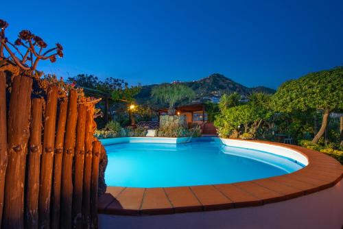 a swimming pool with a fence around it at Hotel Villa Sirena in Ischia