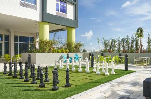 a giant chessboard on a lawn in front of a building at Home2 Suites By Hilton Ft. Lauderdale Downtown, Fl in Fort Lauderdale