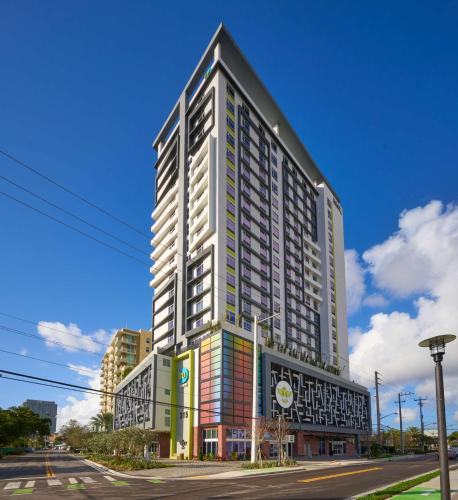 a tall building on the corner of a street at Home2 Suites By Hilton Ft. Lauderdale Downtown, Fl in Fort Lauderdale