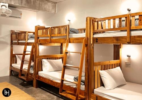 a group of bunk beds in a room at BAAN650 Hostel in Ban Kohong