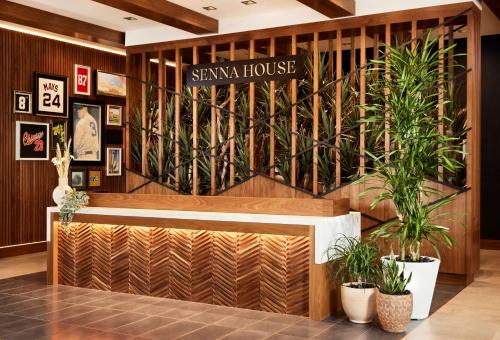 a lobby of a santa fe house with potted plants at Senna House Hotel Scottsdale, Curio Collection By Hilton in Scottsdale