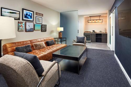a living room with a couch and chairs and a table at Hotel MDR Marina del Rey- a DoubleTree by Hilton in Los Angeles