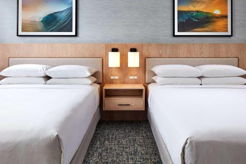two beds in a hotel room with two beds at Hotel MDR Marina del Rey- a DoubleTree by Hilton in Los Angeles