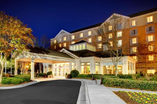a large building with a street in front of it at Hilton Garden Inn Atlanta North/Alpharetta in Alpharetta
