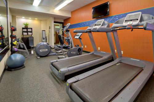 a gym with cardio equipment and a treadmill at Hampton Inn Charlotte University Place in Charlotte