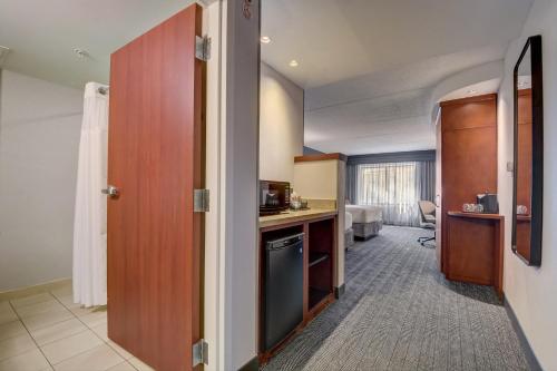 a room with a kitchen and a living room at Courtyard Cincinnati North at Union Centre in West Chester