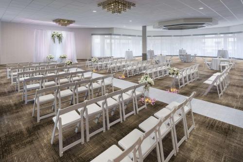 a banquet hall with rows of tables and chairs at DoubleTree by Hilton Colorado Springs in Colorado Springs