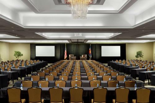 an empty conference room with chairs and a chandelier at DoubleTree by Hilton Colorado Springs in Colorado Springs