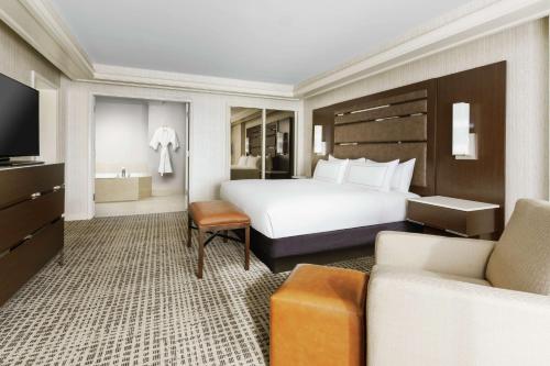 a hotel room with a bed and a couch at DoubleTree by Hilton Colorado Springs in Colorado Springs