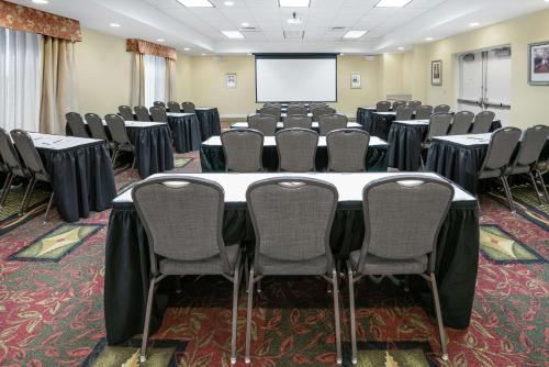 a conference room with a large table and chairs at Hilton Garden Inn McAllen Airport in McAllen