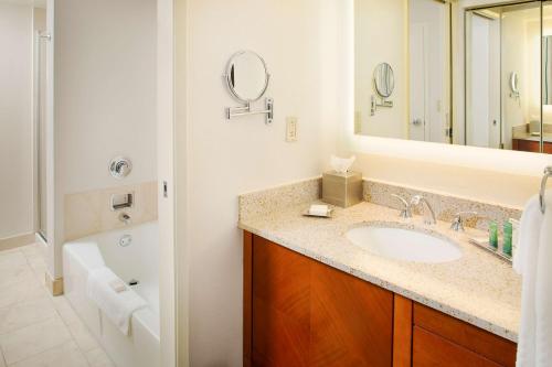 A bathroom at Hilton Atlanta Perimeter Suites