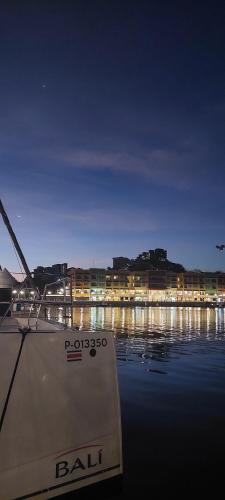 a boat sitting in the water at night at Las Catalinas Loft - for up to 4 people just steps from the beach in Playa Danta