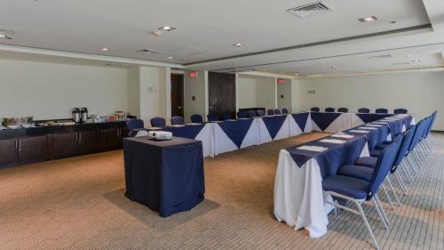 a conference room with blue and white tables and chairs at Holiday Inn Express Culiacan by IHG in Culiacán