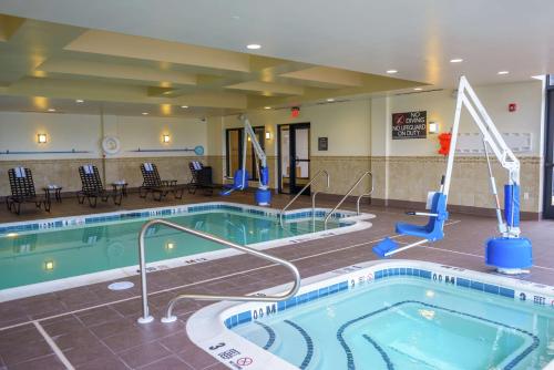 a large pool in a hotel room with a pool at Hilton Garden Inn Exton-West Chester in Exton