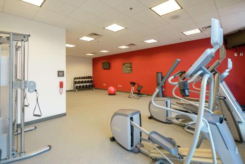 a gym with cardio machines and a red wall at Hilton Garden Inn Exton-West Chester in Exton