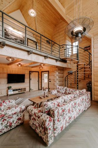 a large living room with couches and a tv at Chata za wsią - Czorsztyn Lake, Kluszkowce Ski in Kluszkowce