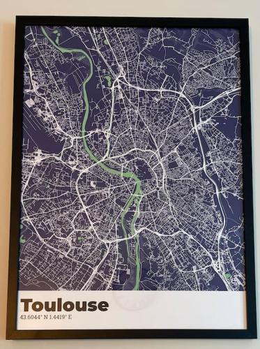 a framed picture of a map of a city at L'Ovalie Appartement T2 CLIMATISÉ et JARDIN in Toulouse