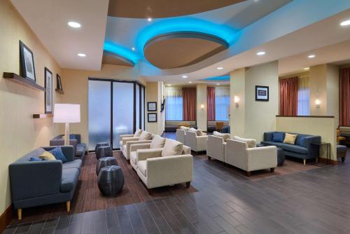 a waiting room with couches and chairs in a hospital at Hampton Inn Washington DC - Convention Center in Washington