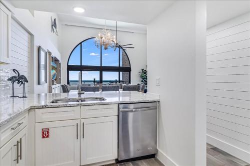 a kitchen with a sink and a window at 8th Floor Penthouse Luxury Beautifully Remodeled in Port Aransas