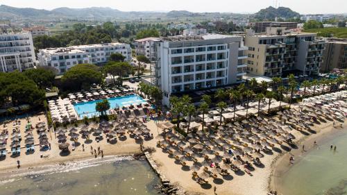 an aerial view of a beach with chairs and umbrellas at Hotel GRINT in Golem