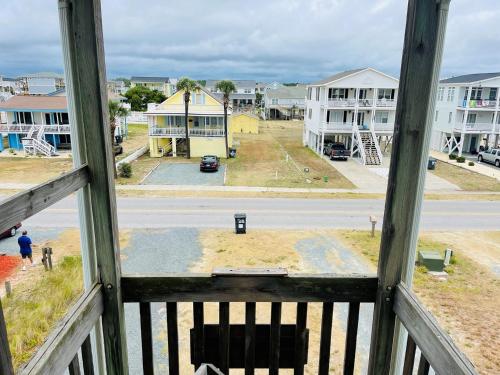 a view from a window of a street and buildings at Serenitee in Holden Beach